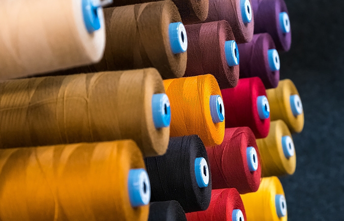 Polyester fibers for weaving and knitting industries